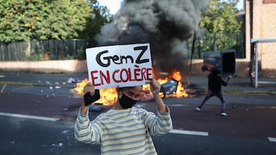 'Gen Z is Angry' reads a placard at a student blockading protest, which is calling for the hiring of substitute teachers, increased resources and decent learning conditions, in Lille, northern France. AFP