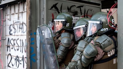 Riot policewomen clash with demonstrators. AFP