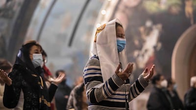 Worshippers at Christmas Mass at the Archangel Michael Coptic Orthodox Church. The Coptic Orthodox Church traces its origins to the first century when the Apostle Mark is said to have visited Egypt. AFP