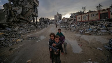 Palestinian children play near temporary shelters where hundreds of displaced families live, in Al Tuffah, east of Gaza city. EPA