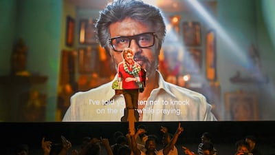 Fans dance during the screening of the film in Mumbai. AFP