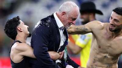 Iraq's Australian coach Graham Arnold celebrates with his players after securing the 48th and final place at the 2026 World Cup. AFP