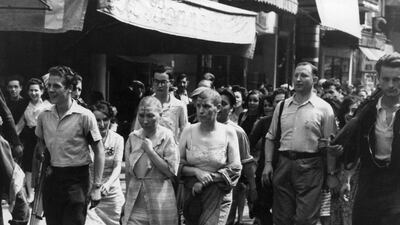 In both the First and Second World Wars, women accused of collaborating with the enemy would be paraded with shaved heads. Three Lions / Getty Images