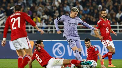Ahly's Egyptian midfielder Hamdy Fathy tackles Real Madrid's Uruguayan midfielder Federico Valverde. AFP
