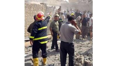 Al Qa'eda has been weakened as its leadership is detained or killed, but is still a threat to Iraq's stability. Above, emergency response teams control the site of a car bombing on Friday in Tuz Khormato.