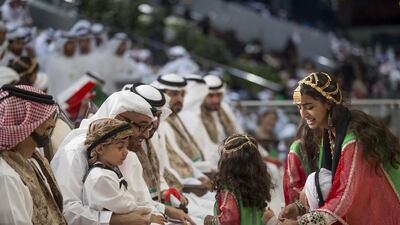 Sheikh Ammar bin Humaid Al Nuaimi, Crown Prince of Ajman, left, Sheikh Tahnoon bin Mohamed bin Tahnoon, second left, and Sheikh Mohammed bin Zayed, Crown Prince of Abu Dhabi and Deputy Supreme Commander of the UAE Armed Forces, third left, at National Day celebrations at the Abu Dhabi National Exhibition Centre with Sheikha Hessa bint Mohammed bin Hamad bin Tahnoon, right. Mohamed Al Hammadi / Crown Prince Court - Abu Dhabi