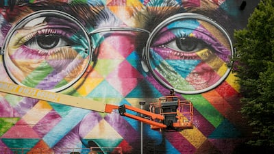 The finishing touches being made to a portrait of John Lennon by the Brazilian artist Eduardo Kobra on the final day of 'Upfest', Europe's largest street art festival in 2017 in Bristol