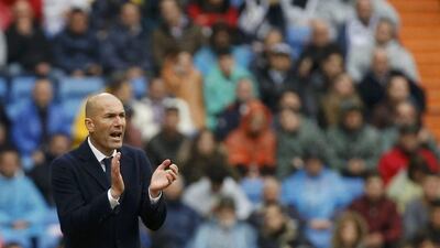 Real Madrid manager Zinedine Zidane urges his team during their La Liga win on Sunday. Paul Hanna / Reuters / May 8, 2016