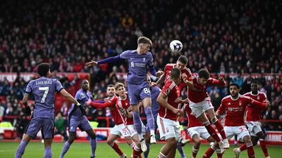 Liverpool's Conor Bradley jumps for a header in the Nottingham Forest box. AFP