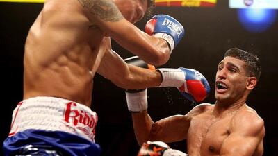 British boxer Amir Khan, right, won a social-media poll to determine Floyd Maywether Jr’s next opponent, but no deal is set. Scott Heavey / Getty Images