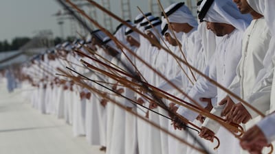 Men sing and dance during the royal wedding reception held at the Al Nahyan Celebration Area , also celebrated the marriage of one hundred additional grooms. Christopher Pike / Crown Prince Court - Abu Dhabi