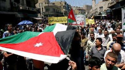 Pro-reform activists have taken to the streets across Jordan, stepping up their calls for the prime minister to resign because they say he has failed to fight corruption. Nader Daoud / AP Photo