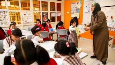 :Amna Abdul Razzaq teaches English to Grade 1 students at Al Andalus School for Basic Education Cycle 1 for Girls in Sharjah.