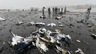 Russian emergency rescuers and forensic investigators work on the wreckage of the flydubai passenger jet which crashed, killing all 62 people on board as it tried to land in bad weather in the city of Rostov-on-Don on March 19, 2016. AFP