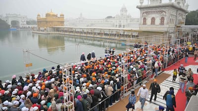 Devotees gather to pay their respects at the Golden Temple on the New Year's Day in Amritsar. AFP
