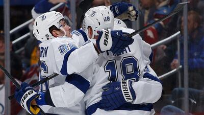 Ondrej Palat, right, of the Tamp Bay Lightning celebrates a goal with teammates Nikita Kucherov, left, and Tyler Johnson, obscured, during a game against the Colorado Avalanche on Sunday. Doug Pensinger / Getty Images / AFP / February 22, 2015