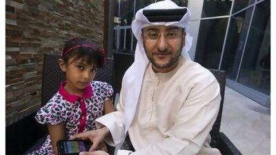Amer Al Hajj, an IT student at the University of Dubai, says the app has helped his daughter Fatima's English pronunciation. Jaime Puebla / The National