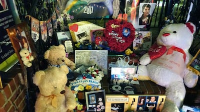 Mourners gather to commemorate the 40th anniversary of the death of singer Elvis Presley at his former home of Graceland. Karen Pulfer Focht / Reuters