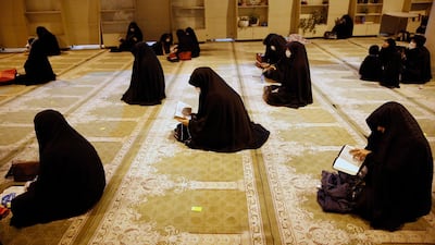 Iranian women wearing face masks pray during a religious ceremony called Laylat Al Qadr in a mosque at the Tehran's university, in Tehran. EPA