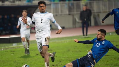 Israel's midfielder #08 Dor Peretz (L) fights for the ball with Kosovo's defender #13 Lumbardh Dellova during the UEFA Euro 2024 Group I qualifying football match between Kosovo and Israel at the Fadil-Vokrri stadium in Pristina on November 12, 2023. (Photo by ARMEND NIMANI / AFP)