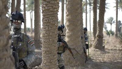 Members of Kut's Swat unit train on the outskirts of the city in the Wasit province, southern Iraq.