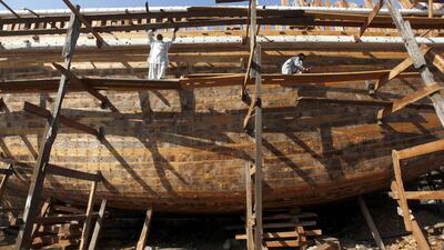 Work progresses on a boat in Karachi's Fish Harbour. Akhtar Soomro / Reuters