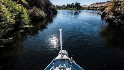 A boat sails on the Nile River near the southern city of Aswan. Egypt's tourism revenue hit a record $12.6 billion in the 2018/2019 fiscal year as tourists stayed longer and spent more. AFP