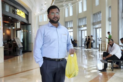 Jithin Alex said more plastic recycling bins would at least prevent bags being thrown away. Pawan Singh / The National
