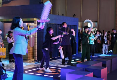 Visitors try a Minecraft-themed experience at Tokyo Game Show 2026. AFP
