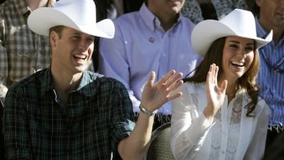 Prince William and Catherine, the Duchess of Cambridge, wave at the start of the 2011 Calgary Stampede Parade in Calgary, Alberta on their nine-day tour in Canada on July 8, 2011. Timothy A Clary / AFP Photo