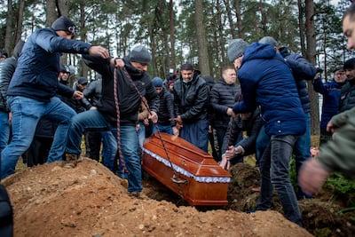 The coffin of Yemeni migrant Mustafa Mohammed Murshid al-Raymi is lowered into a grave at his funeral in Poland. EPA