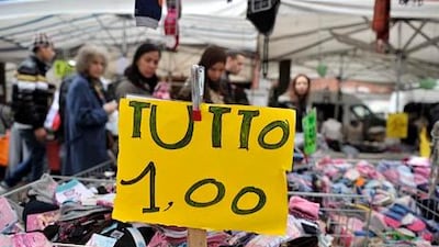 The prospect of Silvio Berlusconi's return to power in Italy poses a risk to reforms. Above, customers at a market in Milan. Paolo Bona / Reuters