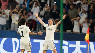 Bale celebrates with his Real Madrid teammates.