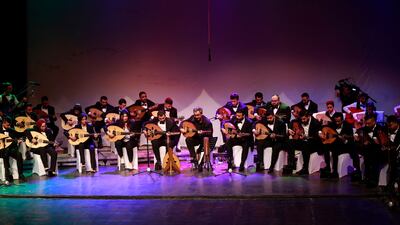 Iraqi musicians play the oud during a concert at Al Rasheed theatre in Baghdad. All photos: AFP