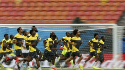 Cameroon players take part in a run during a training session on Tuesday ahead of their Wednesday match at the 2014 World Cup against Croatia. Andres Stapff / Reuters / June 17, 2014