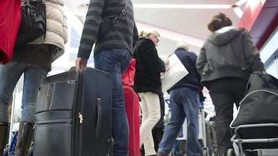 Readers debate whether airlines should have a standard for clothing. Gero Breloer / AP Photo