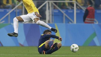 Brazil's Neymar jumps over Colombia goalkeeper Cristian Bonilla during a quarter-final match of the men's Olympic football tournament between Brazil and Colombia in Sao Paulo, Brazil, Saturday August 13, 2016. Leo Correa / AP Photo