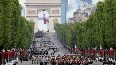 The military parade, pictured here with the Arc de Triomphe in the background on the Champs-Elysees, takes place annually in Paris on July 14. AFP
