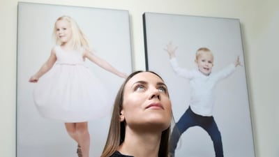 Mute founder Lotte Raun hung photographs of her children on the stairwell wall of her Arabian Ranches villa, the canvases of which absorb sound waves and turn them into micro vibrations. Photo: Mute