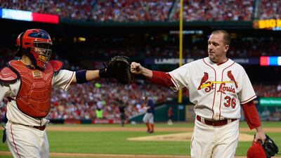 Randy Choate, right, of the St Louis Cardinals is congratulated by Yadier Molina after getting out of the seventh inning against the Washington Nationals at Busch Stadium on June 14, 2014 in St. Louis, Missouri. Jeff Curry / Getty Images