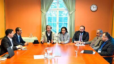 Representatives of the Houthi rebel delegation (L) and representatives of the Yemeni government's delegation (R) pose for a picture during the ongoing peace talks on Yemen. AFP