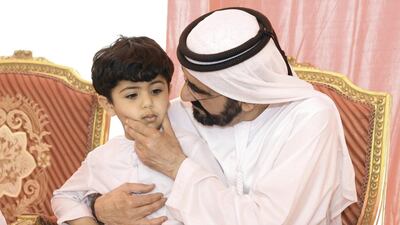 Sheikh Mohammed bin Rashid with the family of a fallen Emirati soldier. Wam
