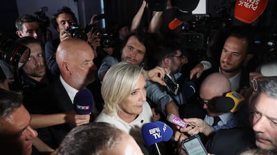 Member of Parliament for the French right-wing party National Rally (Rassemblement National, RN), Marine Le Pen addresses journalists at the party's headquarters in Paris. EPA