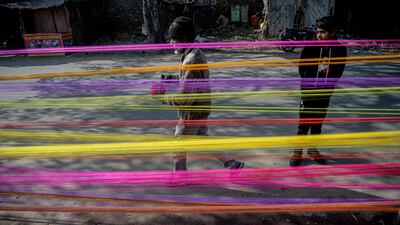 A man prepares kite string ahead of 'Makar Sankranti' and 'Lohri' festival celebrations, in Jalandhar, India. AFP
