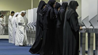 Voters cast their ballots in the 2015 Federal National Council election at the Fujairah FNC voting station. Antonie Robertson / The National