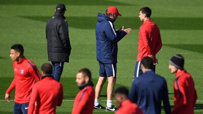 Paris Saint-Germain’s French head coach Laurent Blanc, left, speaks with Paris Saint-Germain’s Italian midfielder Thiago Motta during a training session on April 5, 2016 in Saint-Germain-en-Laye, western Paris, on the eve of the team’s UEFA Champions League football match against Manchester City. Franck Fife / AFP