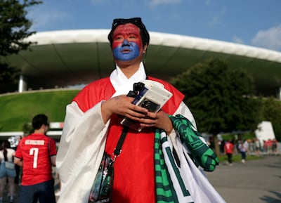 The hanbok, seen on a fan outside Guadalajara Stadium, is the traditional attire of South Korea. Reuters
