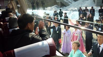 In a file photo taken on February 22, 2014 a South Korean man is seen waving to his North Korean relatives from the window of a bus following a family reunion at the resort area of Mount Kumgang, North Korea. North and South Korea agreed on September 8, 2015 to hold a reunion in October for families separated by the 1950-53 Korean War. AFP Photo