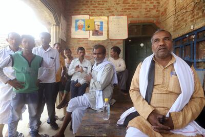 Farmers gather at Ram Sevak Yadav's house in the evenings to teach the local children reading and maths. Jitendra Prakash for The National