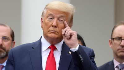 US President Donald Trump pauses during a news conference where he declared the coronavirus pandemic a national emergency in the Rose Garden of the White House in Washington, US, March 13, 2020. Reuters